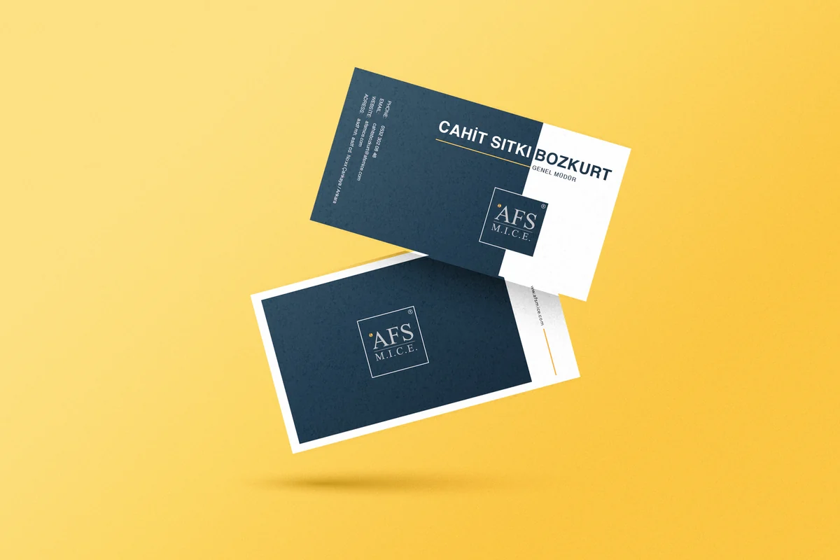Cardboard packaging samples on a yellow ground, printed with a jewellery brand mark.