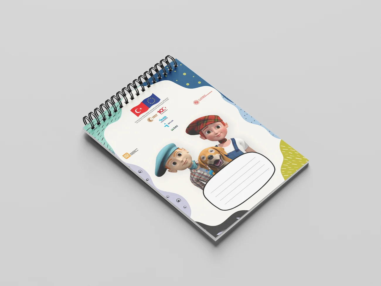A spiral-bound planner lying open, with a weekly grid on one page and illustrated character panels on the other.