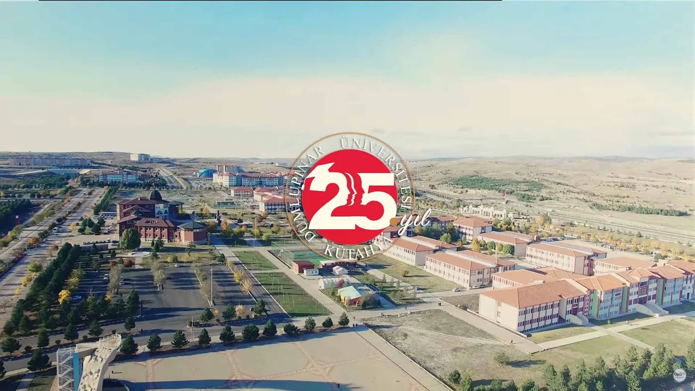 Aerial frame of a university campus with a large anniversary numeral composited over it.