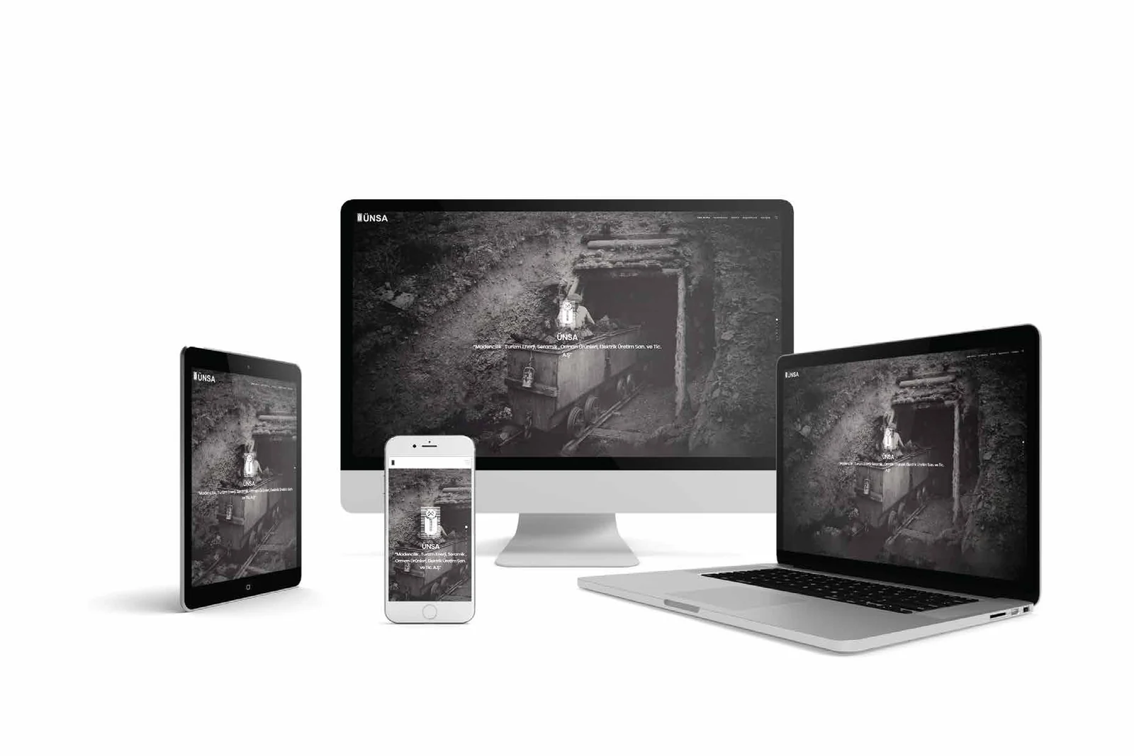 A dark mining company website shown across desktop, laptop, tablet and phone.